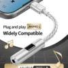jcally-jm6-pro-2-phone-compatibility-pakistan Demonstrating the JCALLY JM6 Pro 2 Type-C DAC dongle plugging into a smartphone, illustrating plug-and-play compatibility for music and gaming anywhere in Pakistan